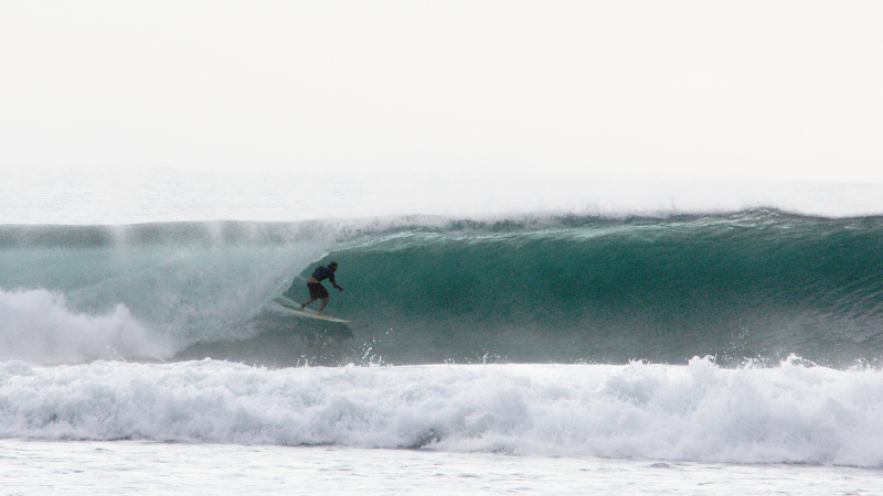 Surfing deep in the tube at Way Jambu